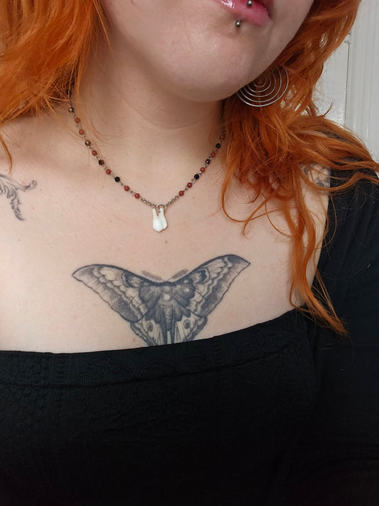 Red and black beaded deer tooth necklace