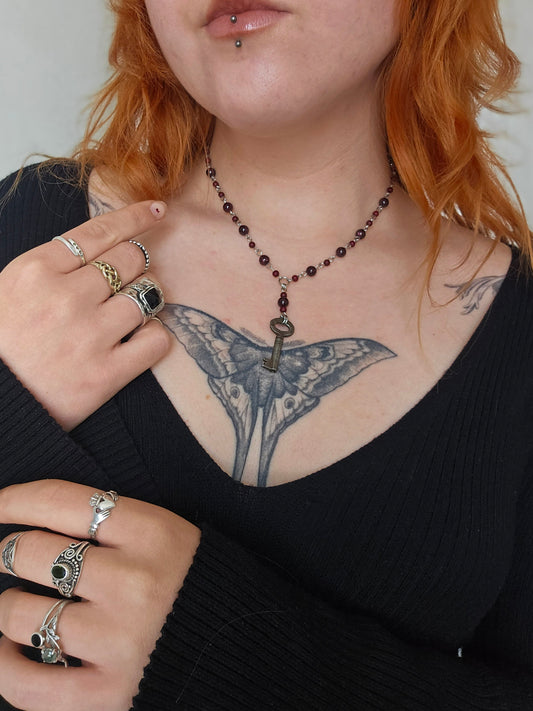 Garnet necklace with an antique key